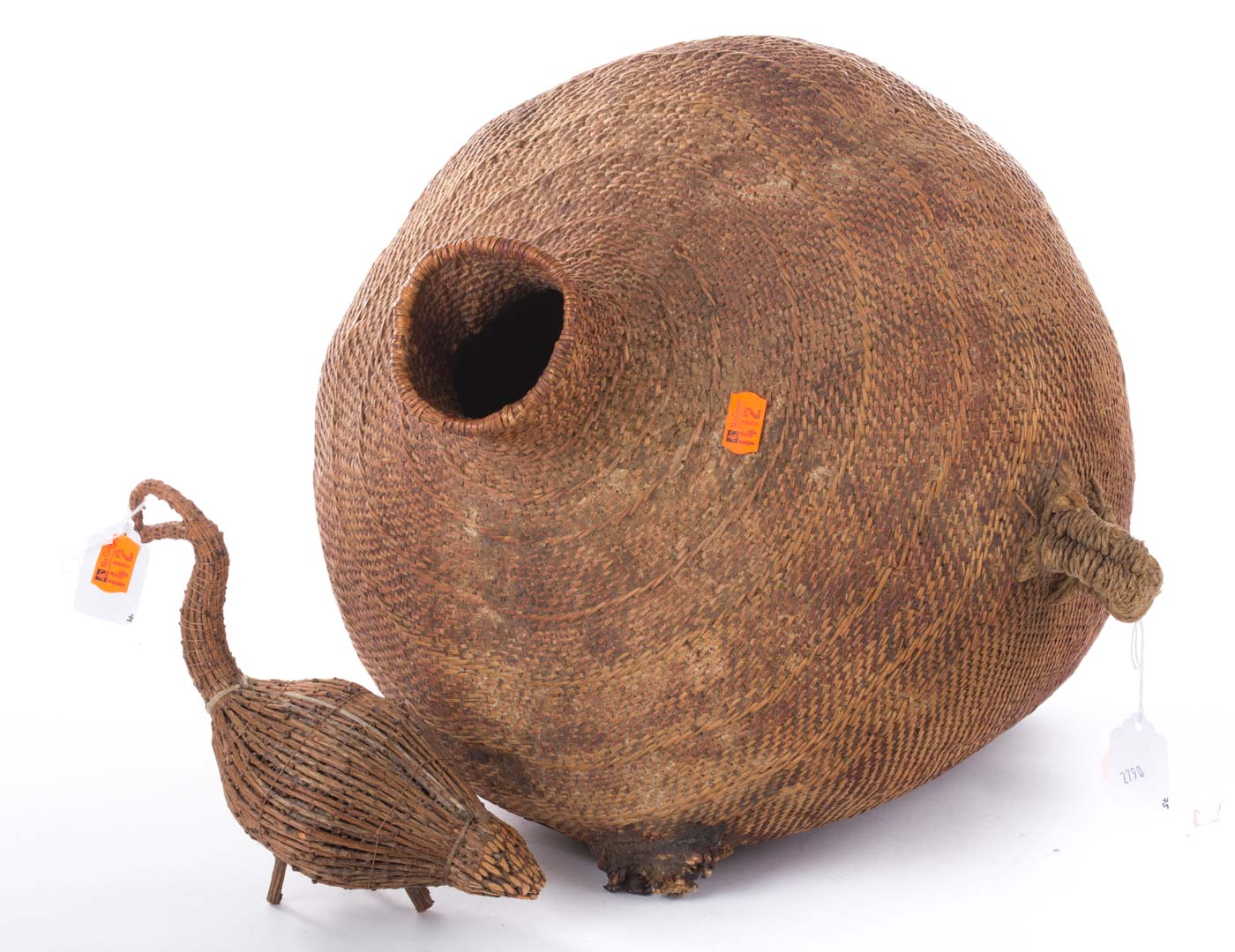 Appraisal: North American Indian woven storage vessel and a reed bird