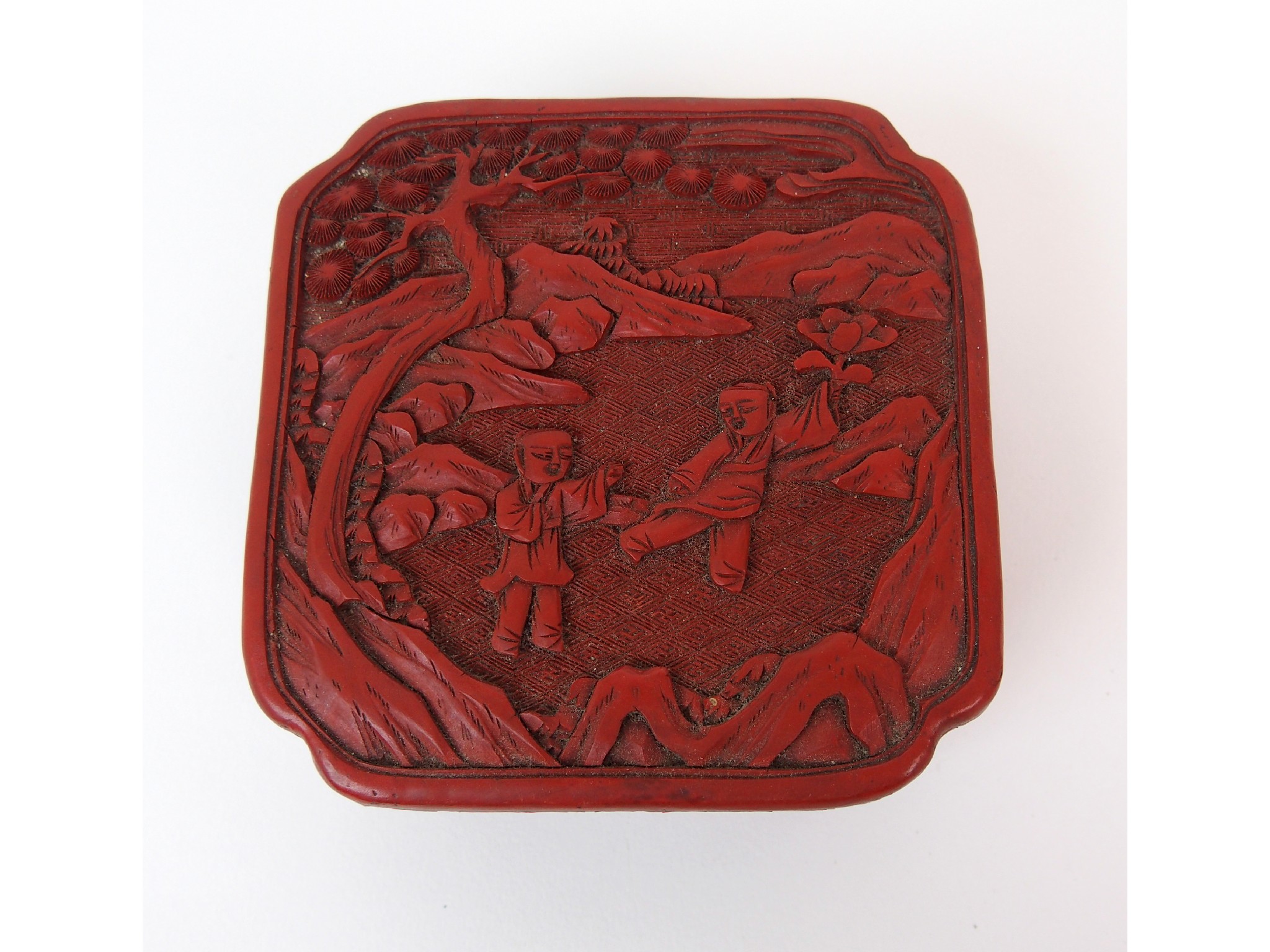 Appraisal: A Chinese cinnabar red lacquer rectangular boxcarved with children beneath