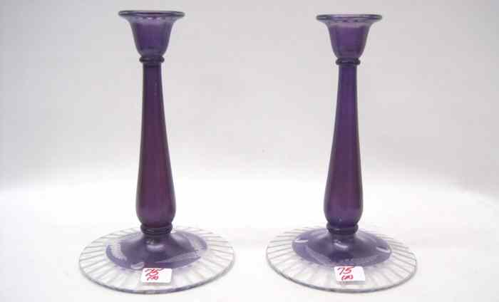 Appraisal: PAIR PAIRPOINT AMETHYST GLASS CANDLEHOLDERS engraved with floral pattern on