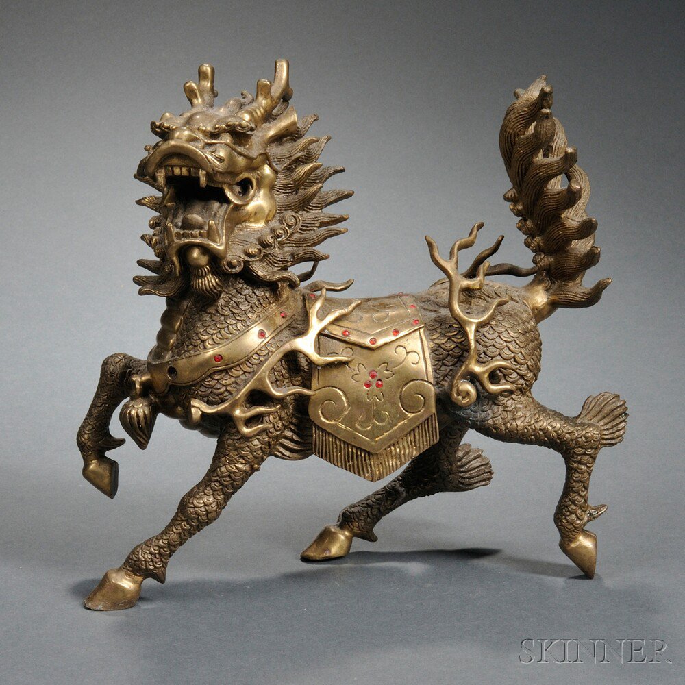 Appraisal: Inlaid Brass Qilin China depicted galloping with a fierce expression