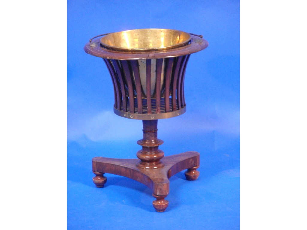 Appraisal: A Victorian mahogany jardiniere stand with brass liner turned stem