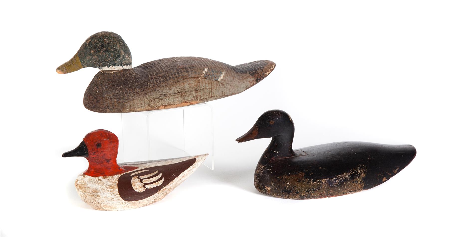 Appraisal: THREE DUCK DECOYS American th century Black and white h