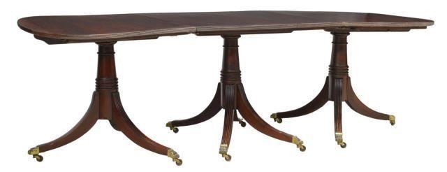 Appraisal: Georgian style mahogany triple pedestal dining table oval tabletop with