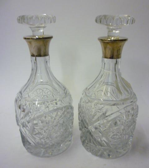 Appraisal: A PAIR OF CLEAR CUT GLASS MALLET DECANTERS maker Mappin