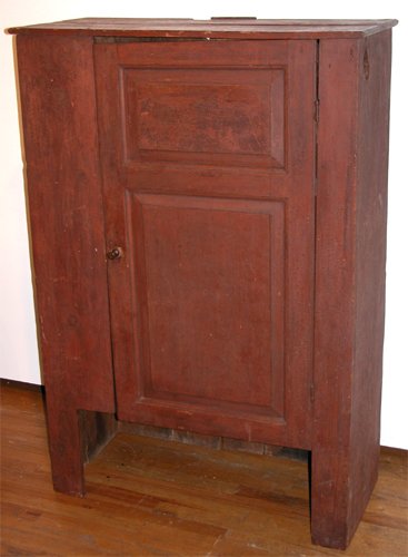 Appraisal: An asymmetrical top cabinet or wall cabinet in original red