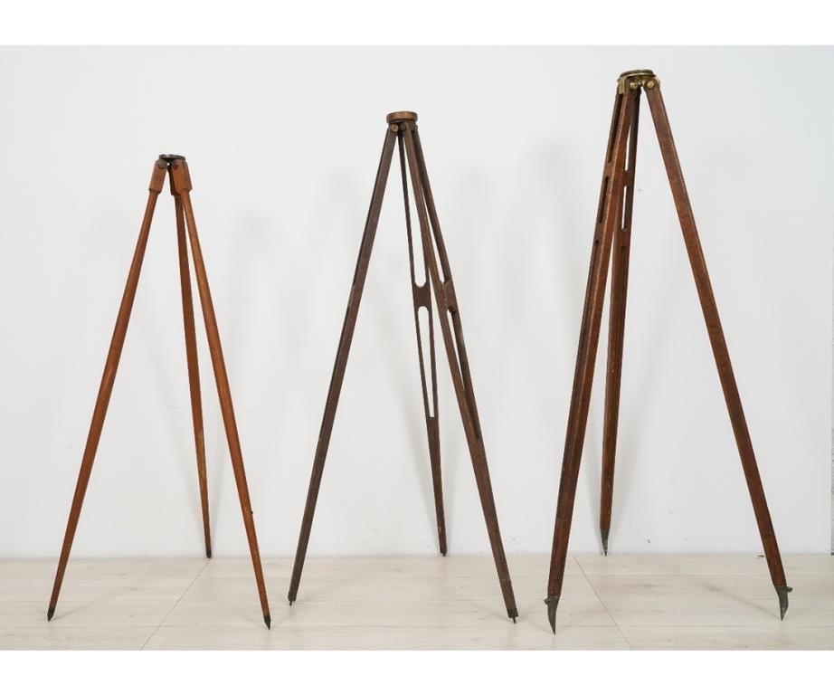 Appraisal: Three wooden transit tripods the smallest a Keuffel Esser Co