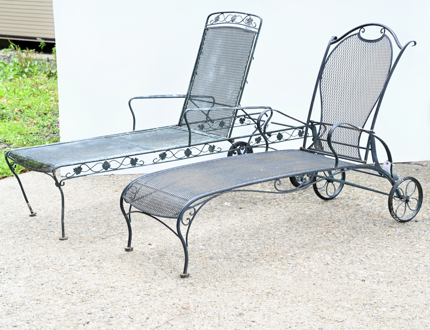 Appraisal: WROUGHT IRON PATIO CHAISE LOUNGE CHAIRS th c green-painted wrought