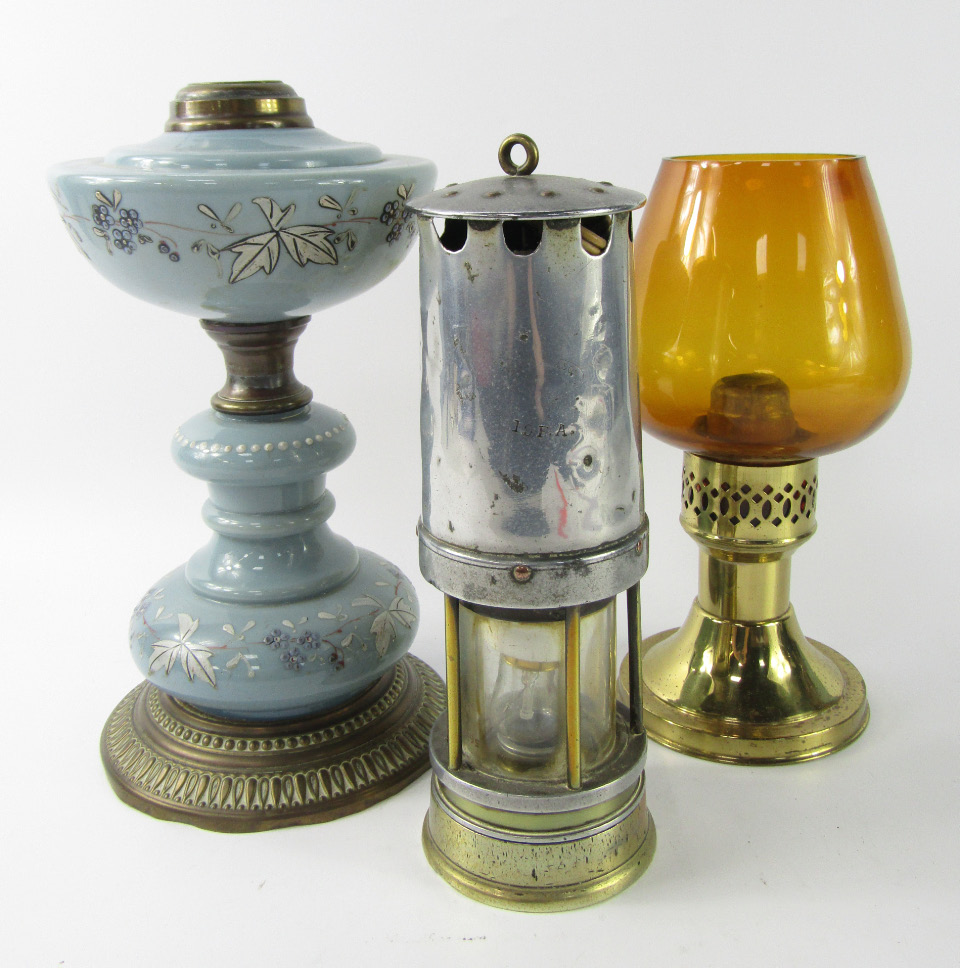 Appraisal: A brass and turquoise opaline glass oil lamp with enamel