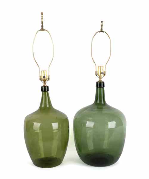 Appraisal: Two green glass demijohns th c converted to electric lamps