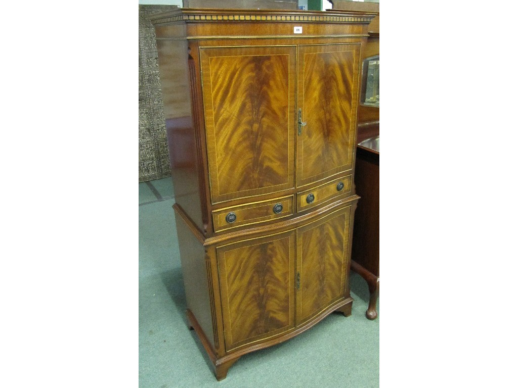 Appraisal: Reproduction mahogany serpentine front drinks cabinet