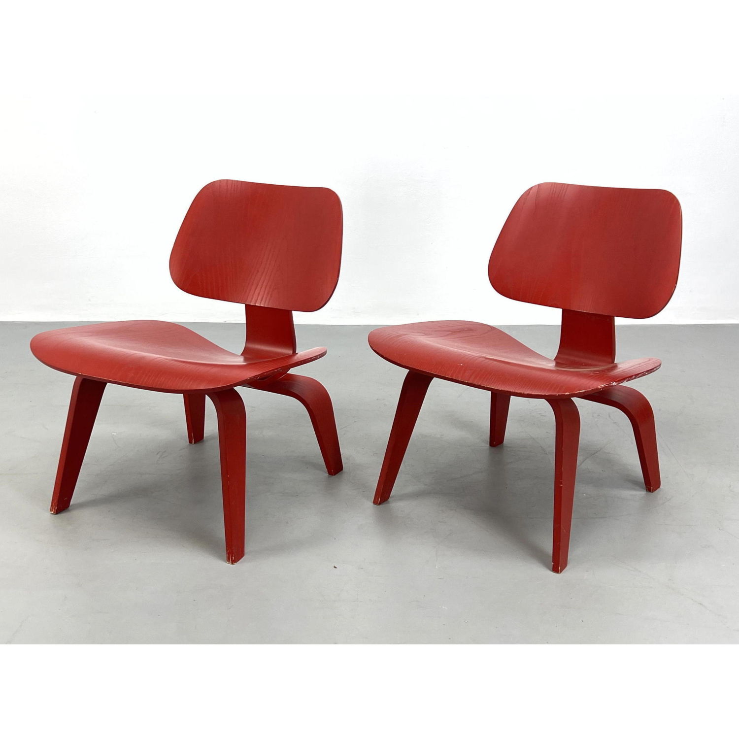 Appraisal: Pair of Red Herman Miller Charles Eames LCW Chairs Labeled