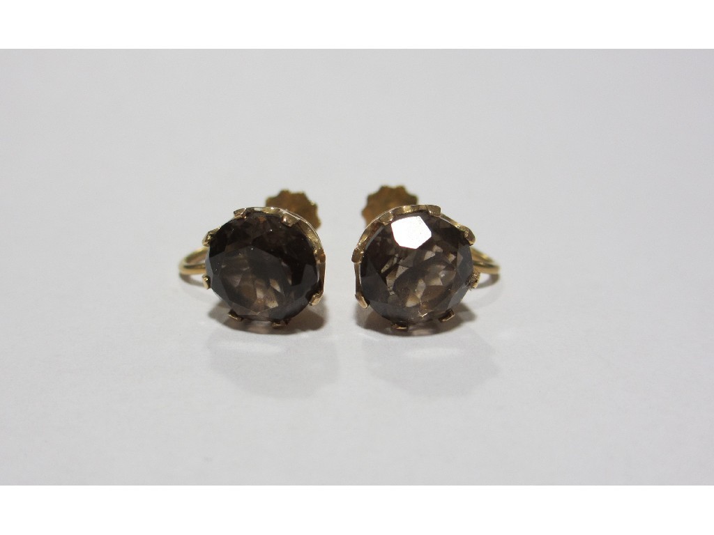 Appraisal: Pair of ct gold mounted smoky topaz screw on stud