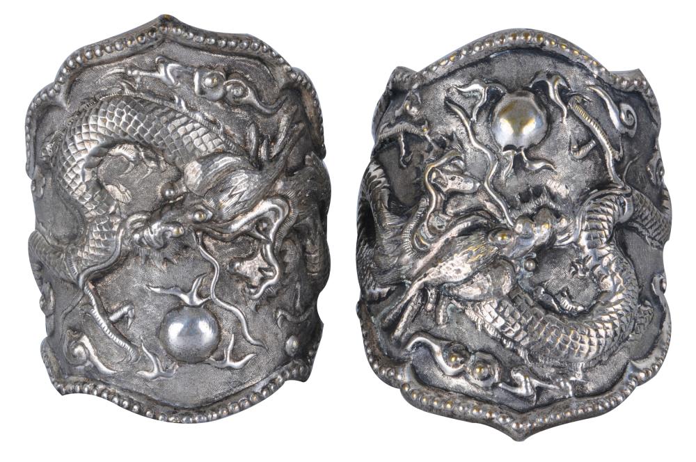 Appraisal: PAIR OF CHINESE DRAGON ARM CUFFSpossibly silver-plated inches wide Condition