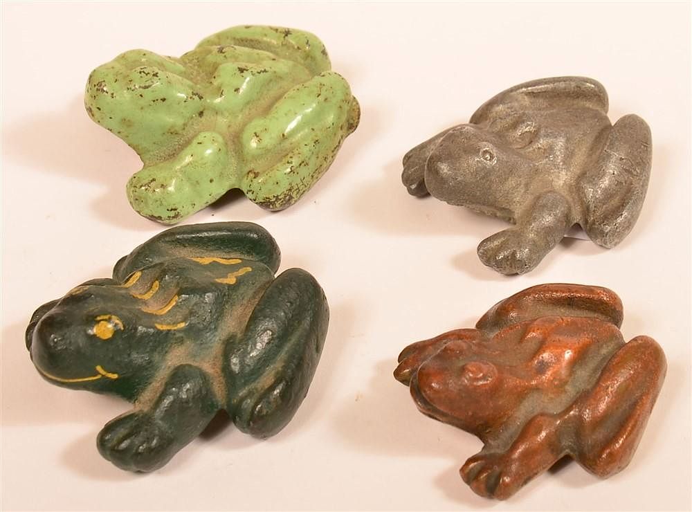 Appraisal: Four Cast Metal Frog Paperweights Four Cast Metal Frog Paperweights