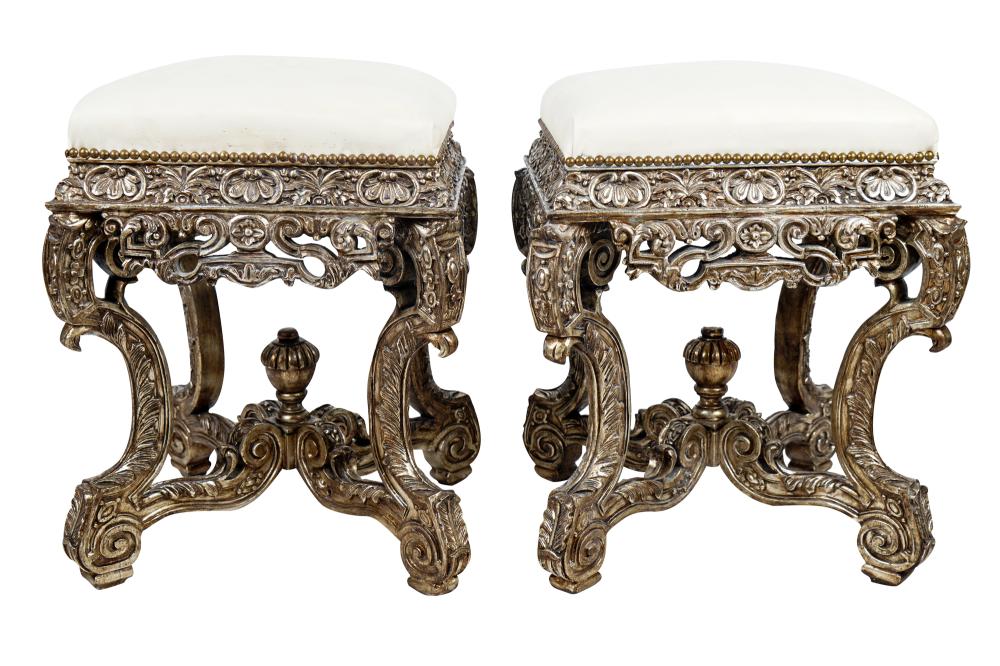 Appraisal: PAIR OF REGENCE STYLE SILVERED CARVED WOOD STOOLSwith off-white faux