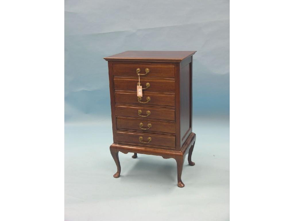 Appraisal: An Edwardian mahogany music chest six fall-front drawers each with