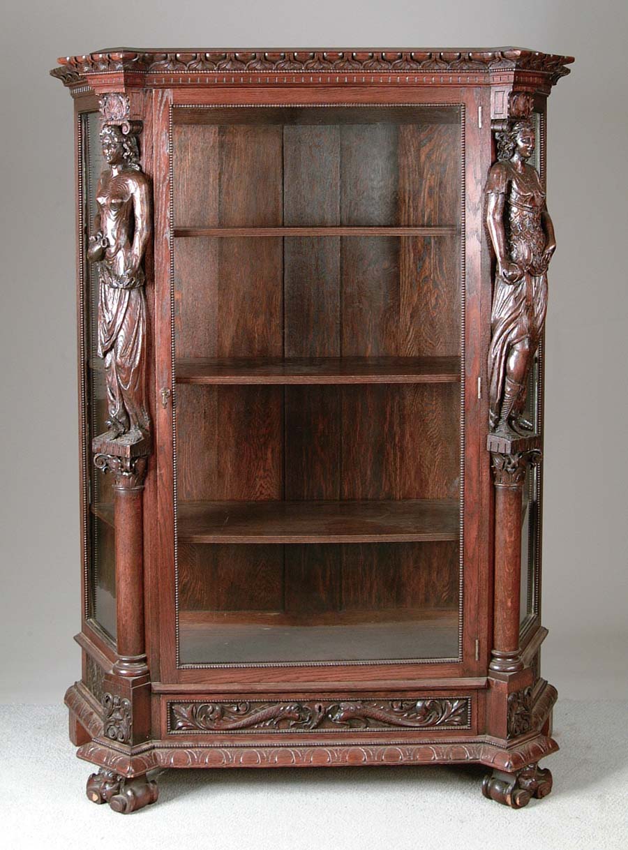 Appraisal: CARVED OAK CHINA CABINET Impressive oak china cabinet starts with