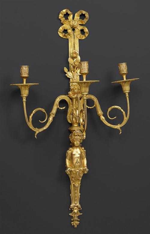 Appraisal: PAIR OF GILT BRONZE APPLIQUES A L'ENFANT Louis XVI style