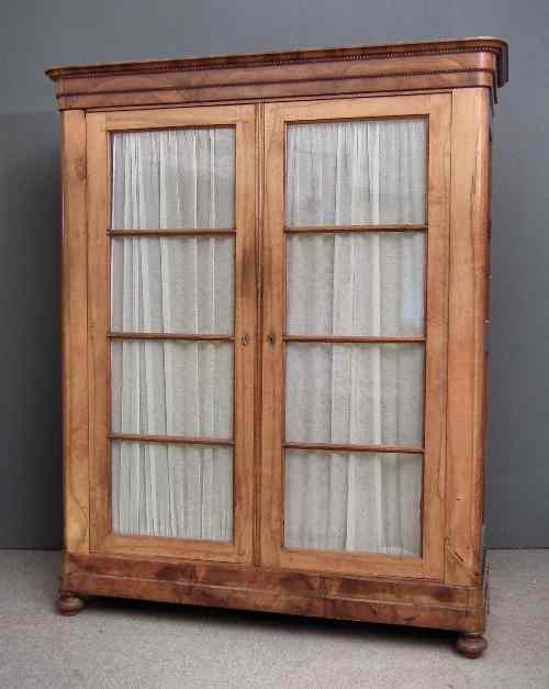 Appraisal: A th Century Continental walnut armoire the stepped moulded cornice