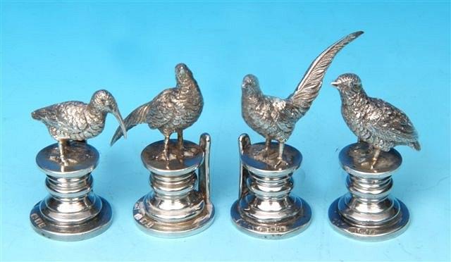 Appraisal: A SET OF FOUR SILVER MENU HOLDERS cast in the