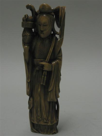 Appraisal: Stained ivory figure of Kannon th century Carved holding a