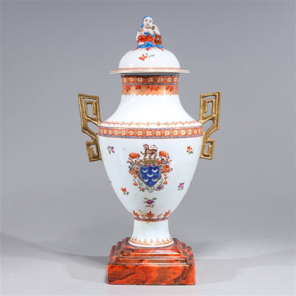 Appraisal: Elaborate Chinese famille rose enameled porcelain vase with molded gilt