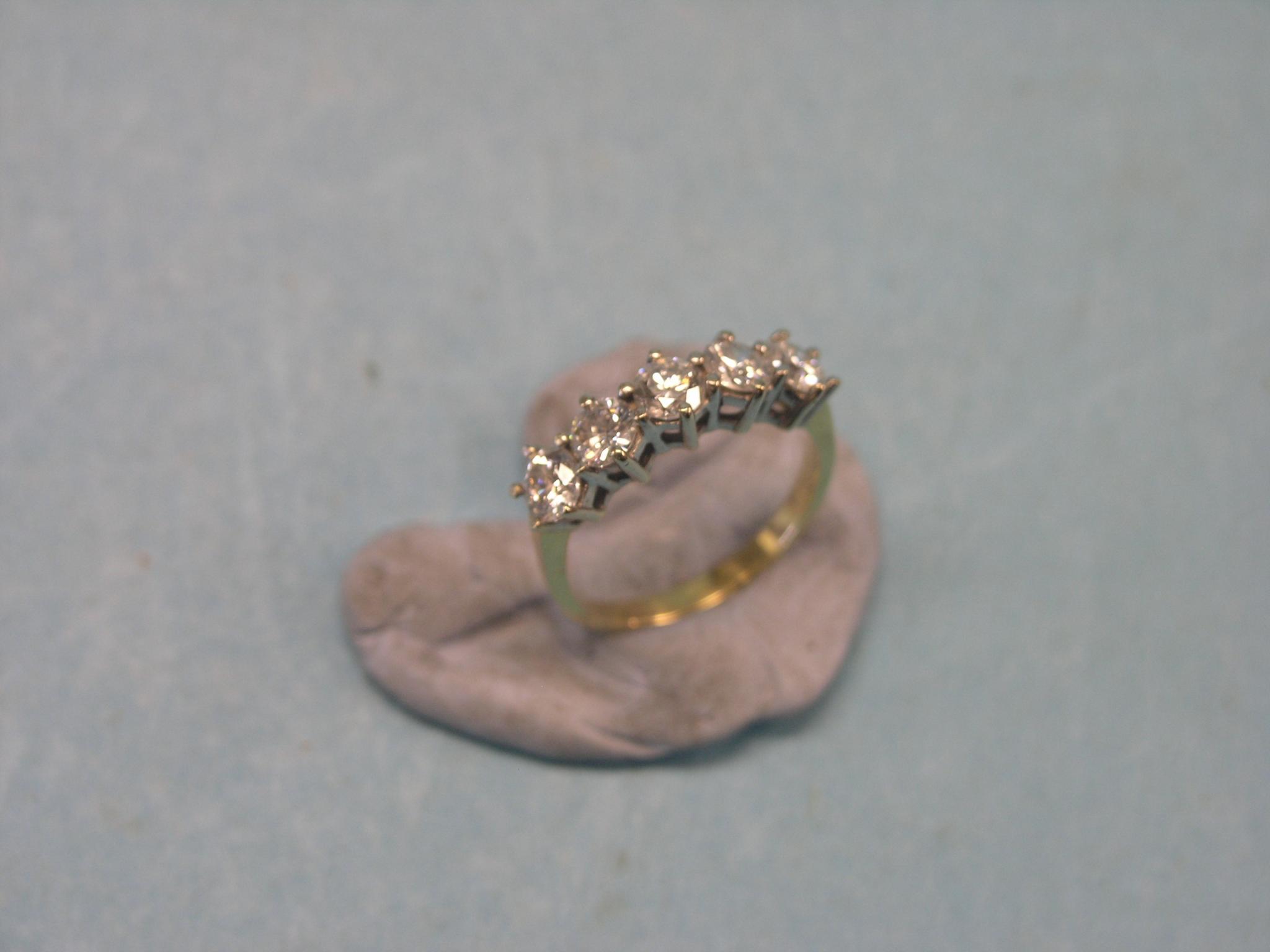 Appraisal: A five-stone diamond half-hoop ring each stone approx ct claw