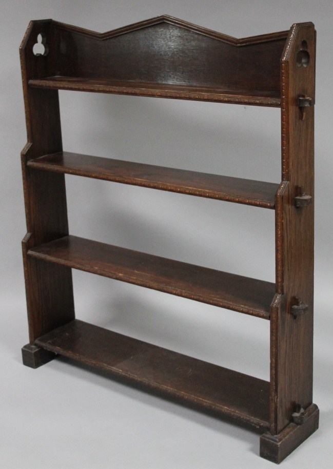 Appraisal: An early thC gothic style oak bookshelf with a carved