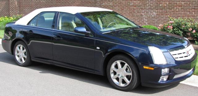 Appraisal: Cadillac Seville STS sedan sapphire blue exterior with white carriage