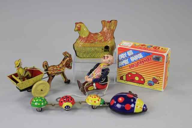 Appraisal: GROUPING OF TIN LITHOGRAPHED TOYS Varied lot includes farmer in