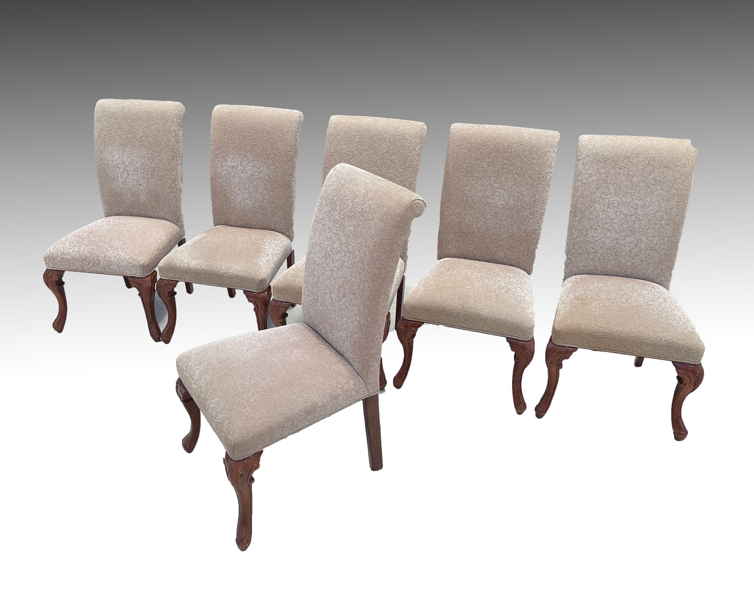 Appraisal: UPHOLSTERED DINING CHAIRS Upholstered in a foliate pattern fabric raised