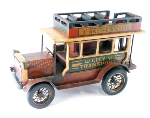 Appraisal: A wooden model of an open top bus with stencilled