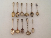 Appraisal: A group of three silver sugar sifter spoons one of