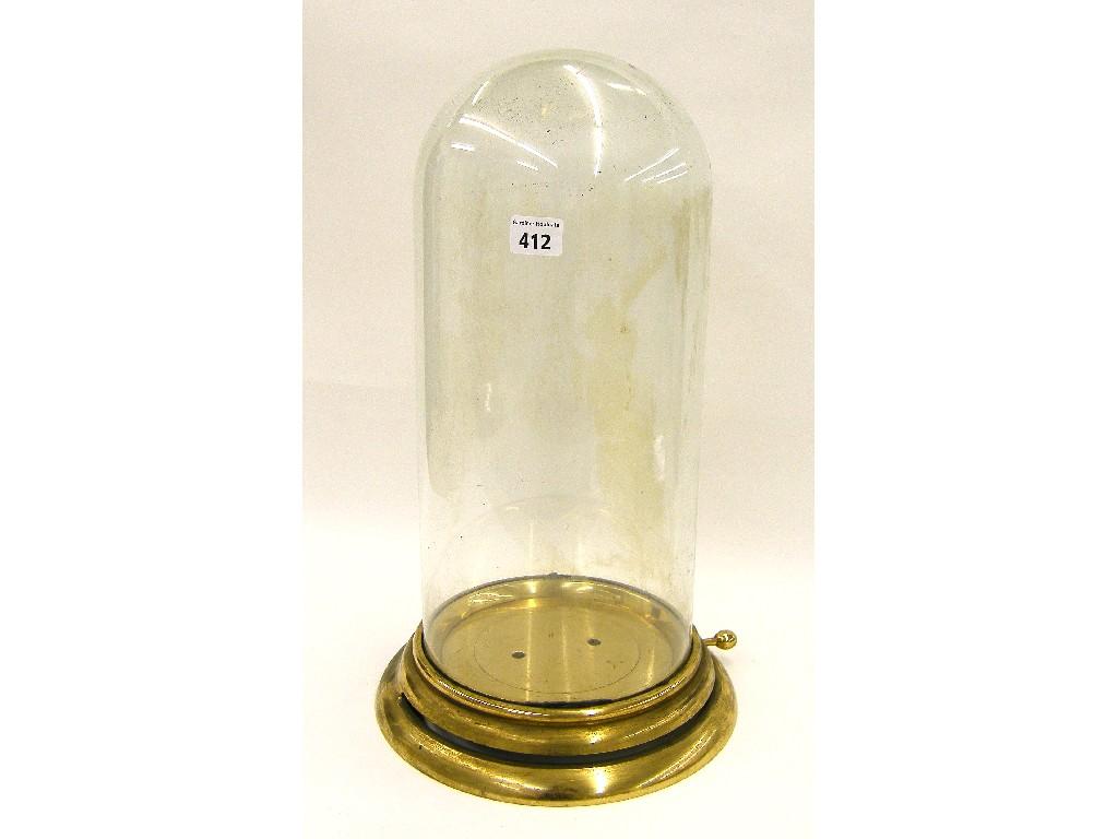 Appraisal: Large glass dome upon a revolving brass stepped circular base