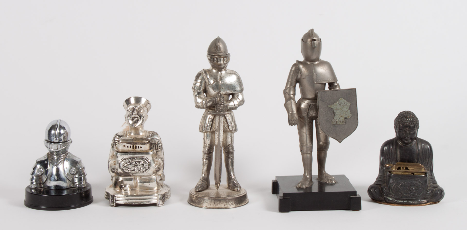 Appraisal: Five figural cigarette lighters s- s includes mandarin Buddha suits