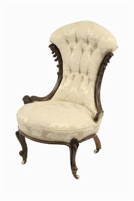 Appraisal: A Victorian carved walnut nursing chair