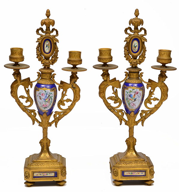 Appraisal: A PAIR OF GILT METAL PORCELAIN MOUNTED TWO BRANCH CANDELABRA