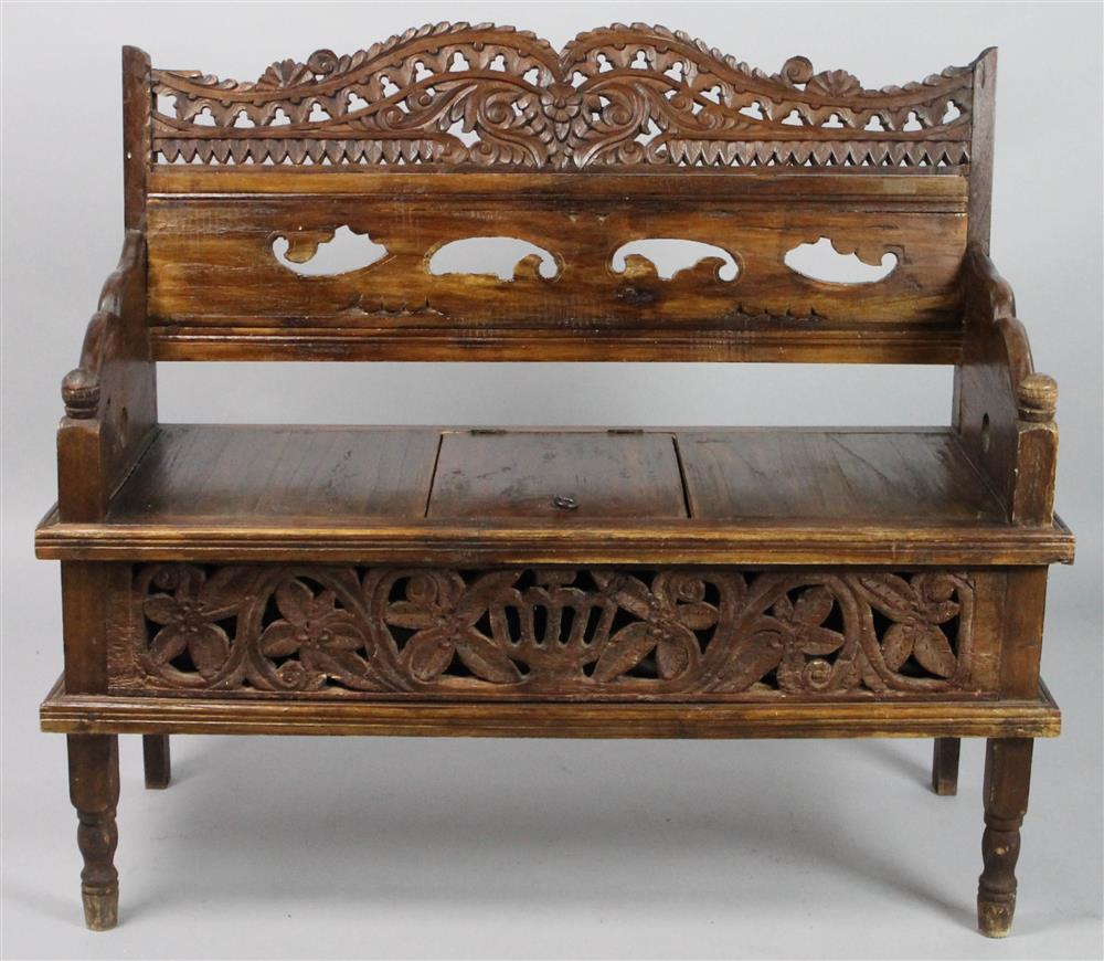 Appraisal: DIMINUTIVE INDONESIAN CARVED HARDWOOD SETTEE having a carved and pierced