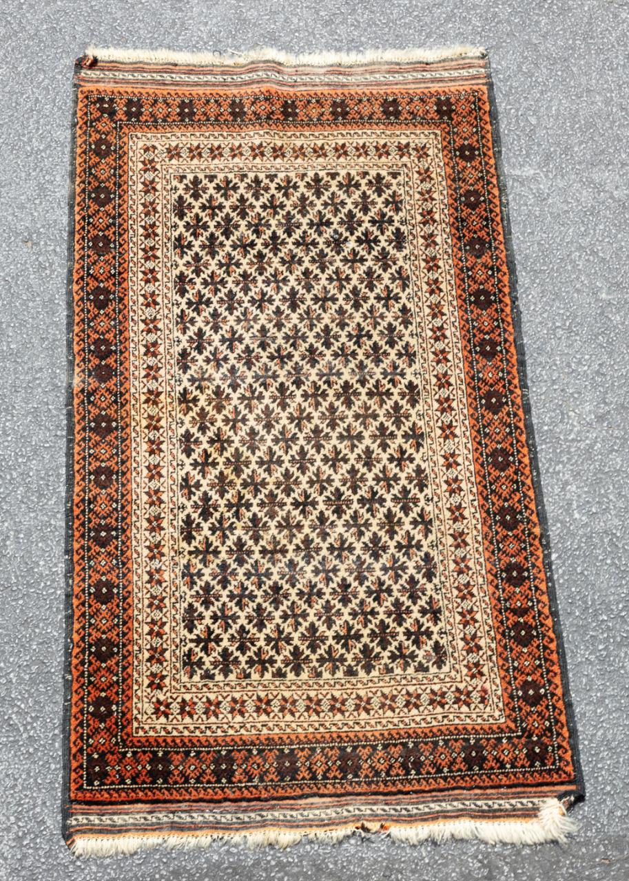 Appraisal: HAND KNOTTED AFGHAN BALUCH RUG X Hand knotted Baluch rug