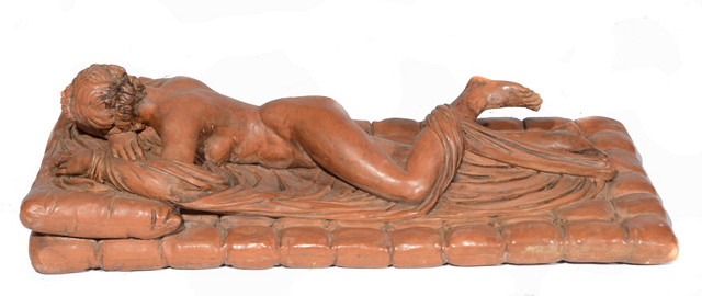 Appraisal: A FRENCH TERRACOTTA MODEL OF A RECUMBENT NAKED MAIDEN on