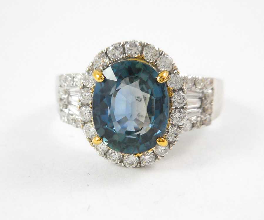 Appraisal: SAPPHIRE DIAMOND AND FOURTEEN KARAT GOLD RING The white and