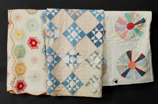 Appraisal: THREE VINTAGE CUTTER QUILTSThree project quilts in 'Grandmother's Flower Garden