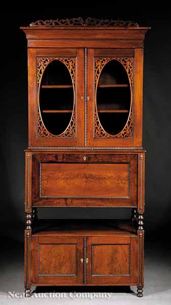 Appraisal: An American Walnut Secretary Bookcase mid- th c reticulated crest