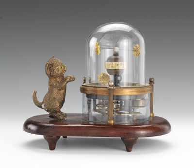 Appraisal: A Novelty Automaton Clock with Kitten and Fish tank Skeleton