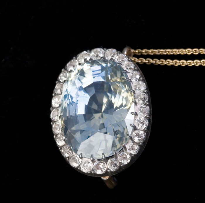 Appraisal: SAPPHIRE DIAMOND SILVER AND GOLD PENDANT The pendant set with