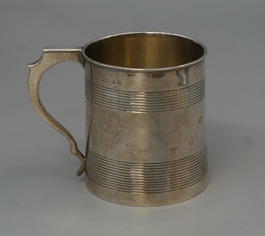 Appraisal: George III sterling silver mug reeded body h London TO