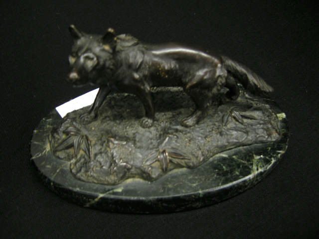 Appraisal: Bronze Figurine of a Wolf black marble oval base oriental