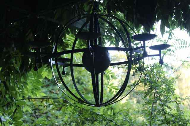 Appraisal: A SET OF THREE WROUGHT IRON SPHERICAL EIGHT LIGHT STRAP