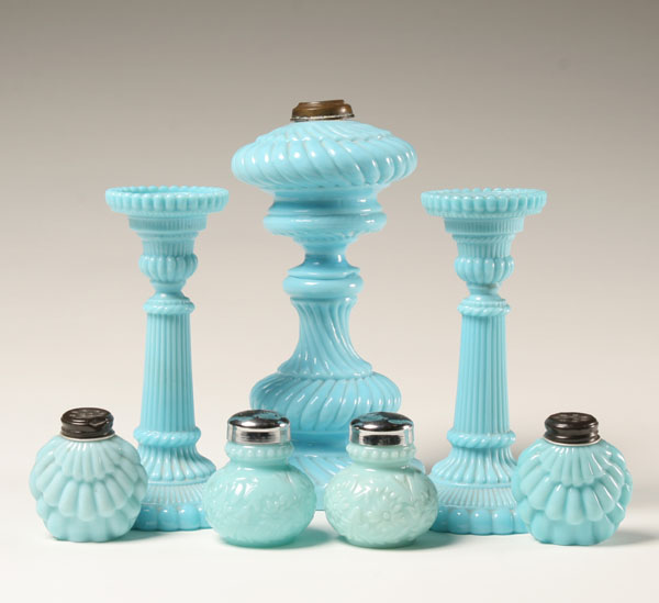 Appraisal: Seven blue milk glass items swirl pattern oil lamp base