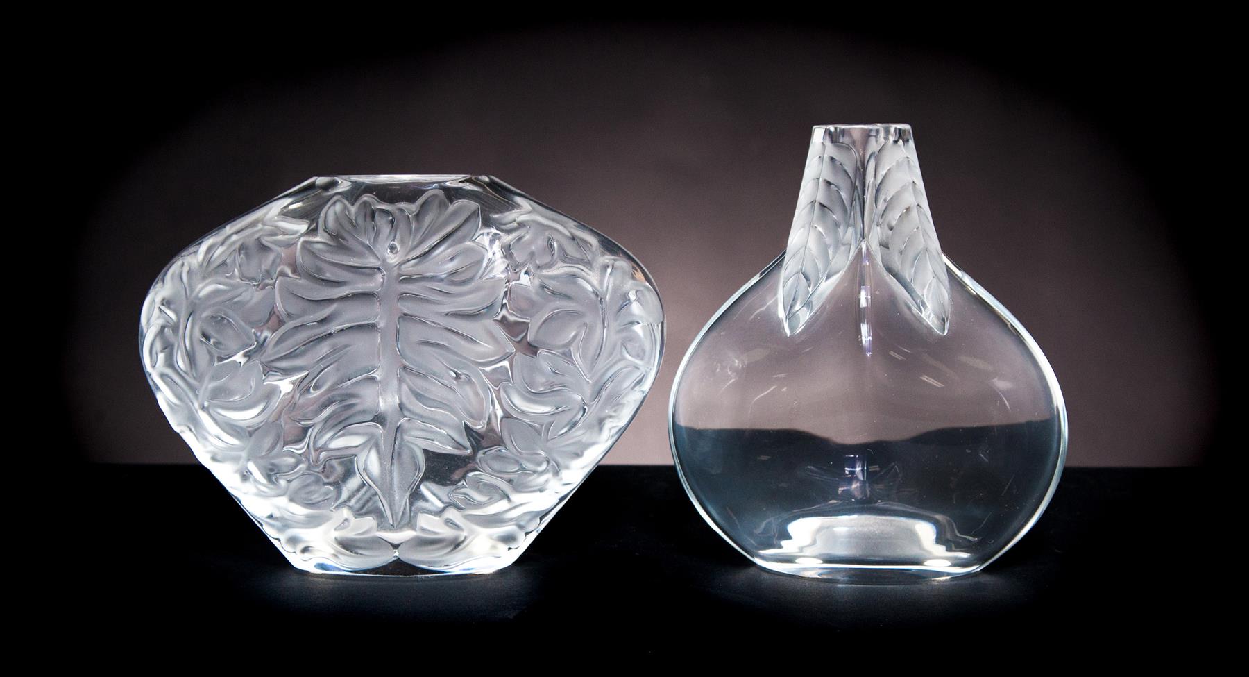 Appraisal: TWO LALIQUE VASES France th century Both with foliage decoration